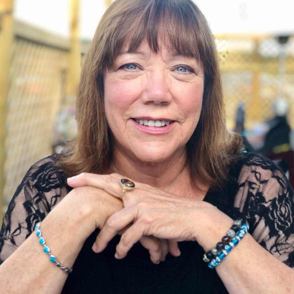 Woman in black lace attire with jewelry